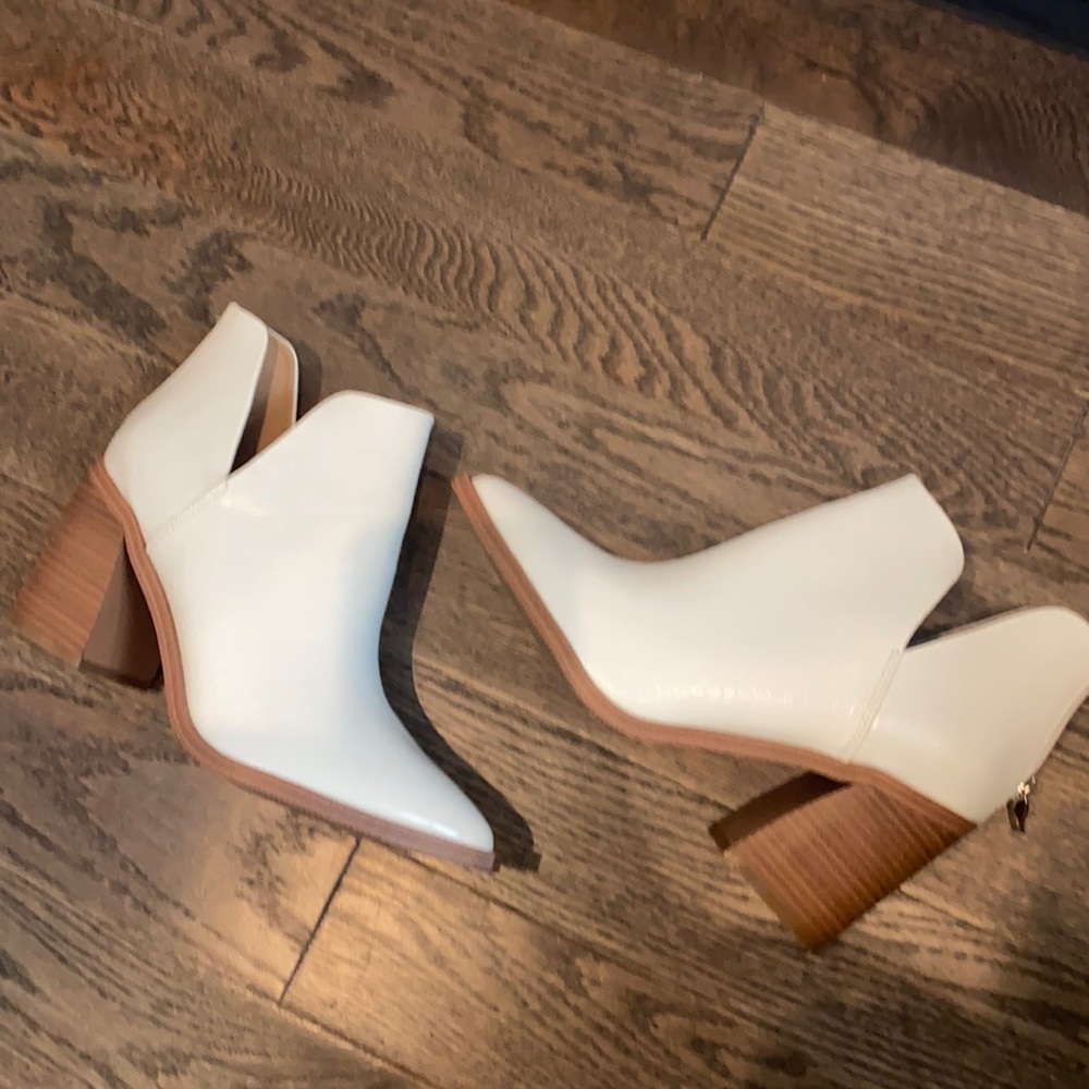 Brand new white booties. Size 9 never worn.